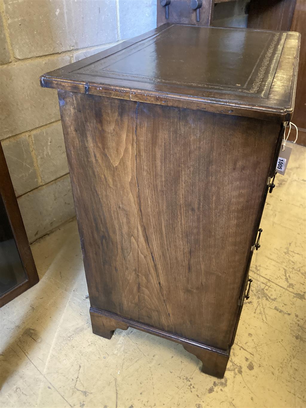 A Queen Anne style walnut kneehole desk, width 74cm, depth 44cm, height 77cm